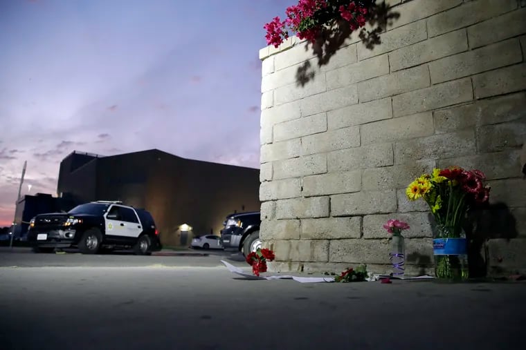 Flowers are placed in front of Saugus High School in Santa Clarita, Calif. in the aftermath of a shooting on Thursday.