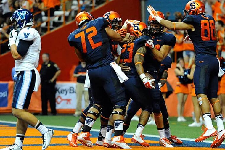 Syracuse Orange running back Prince-Tyson Gulley (23) celebrates a touchdown with teammates against the Villanova Wildcats during the first quarter at the Carrier Dome. (Rich Barnes/USA Today)