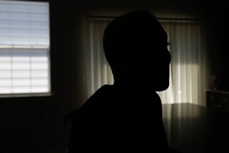Nurse Practitioner Michelle Fisher silhouetted at her South Jersey home on Thursday, April 13.