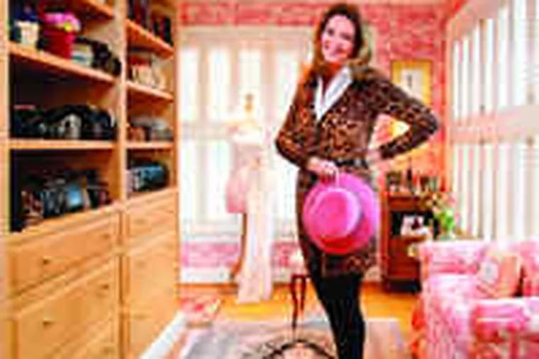 in her fashionable French-inspired closet, with her favorite item, a pink Eric Javits fedora - &quot;They are masculine, but on a woman they are feminine. A little risky.&quot; The Gladywne resident and retired senior vice president of institutional advancement at Drexel collects clutches, shoes, and fashion sketches; the dress form sports a lace Jessica McClintock gown.