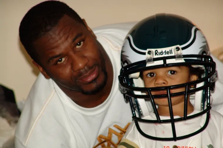 Jeremiah Trotter Jr. tries his dad's Eagles helmet on in Easter of 2005.