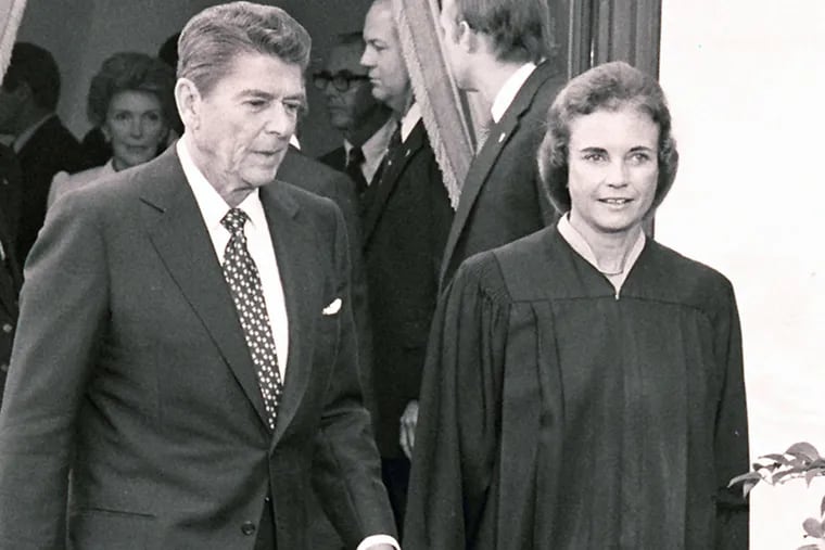 Justice Sandra Day O'Connor and President Ronald Reagan after her historic swearing-in in September 1981.