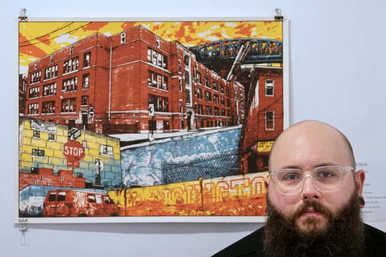 Mike Smaczylo is photographed next to his art work exhibit at the Da Vinci Art Alliance in Philadelphia. Smaczylo, a teacher at Kensington Health Sciences Academy, explores the educational and social landscapes of Philadelphia through visual representations of some the city’s aging schools and the contemporary and increasingly diverse neighborhoods they reside in.