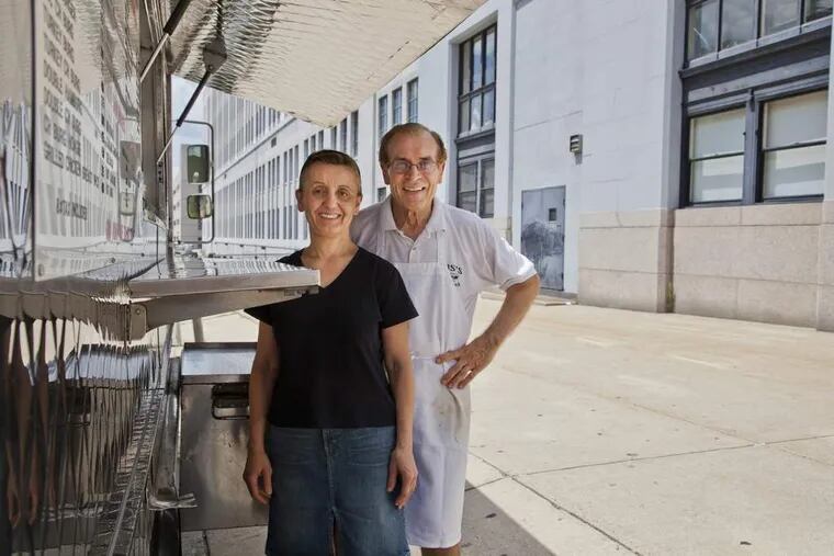 GUS01.  Gus and Joan Katseftis next to the lunch truck at Broad &amp; Callowhill.  Photo by Elise Wrabetz.
