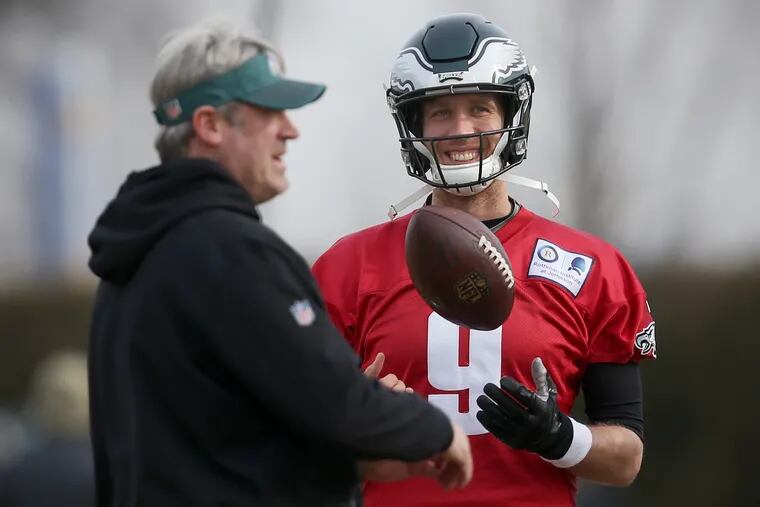 Eagles head coach Doug Pederson and quarterback Nick Foles at practice Friday, before the team left for Chicago to play the Bears in the playoffs.