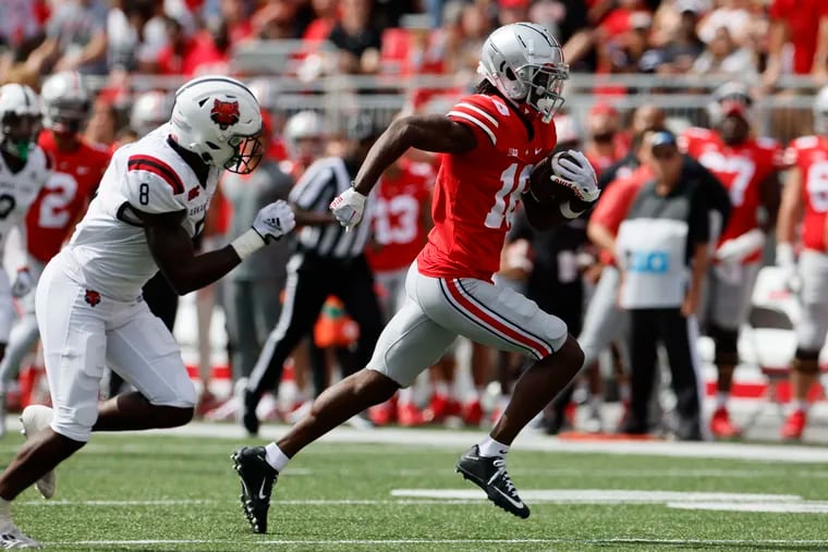 Ohio State receiver Marvin Harrison runs past Arkansas State defensive back Eddie Smith on his way to a touchdown during the first half of an NCAA college football game Saturday, Sept. 10, 2022, in Columbus, Ohio. (AP Photo/Jay LaPrete)