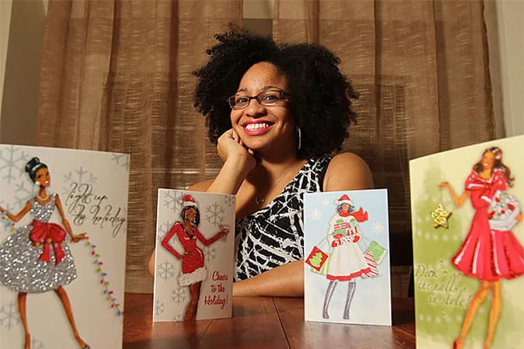 Veronica March&#0233; Miller, a fashion design graduate student at Drexel, with her original cards, on the shelves of T.J. Maxx, Marshalls and HomeGoods this season. (Charles Fox/Staff Photographer)