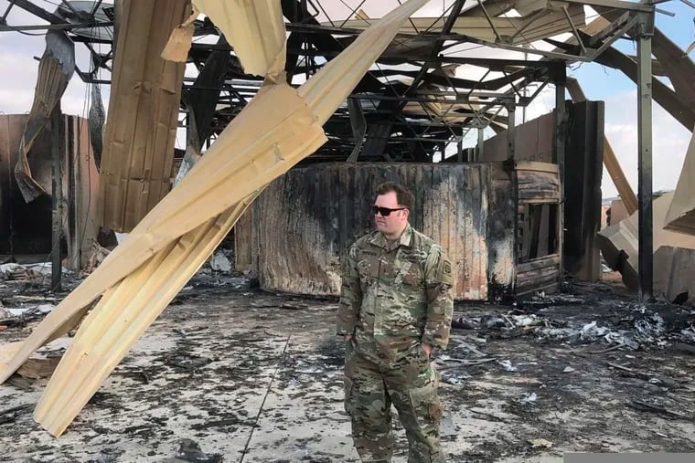 A U.S. soldier stands at a site of Iranian bombing, in Ain al-Asad air base, Anbar, Iraq, Monday.