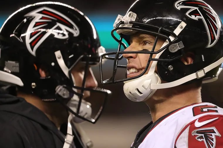 The Falconsâ€™ Matt Ryan, right, reacts during a timeout on their final drive of the game.