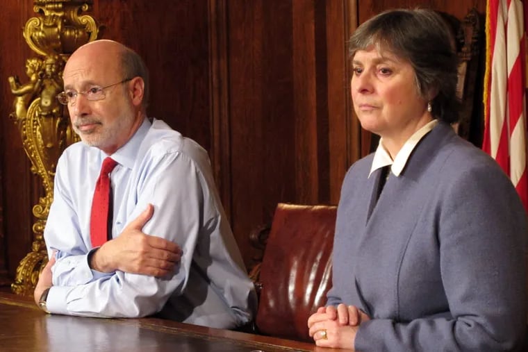 Joined by his wife, Frances, Gov. Wolf listens to a question about his prostate cancer at a news conference in his office.