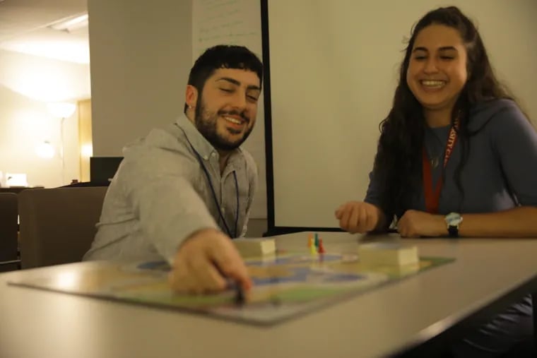 Shawn McLaughlin, left Ilana Stern, right play Ungame the board game used to create a positive environment to discuss personal life between students at Temple University in the Tuttleman Counseling Center and Resiliency Resource Center on January 25, 2019.