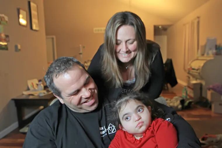 Amelia, 3, with parents Joe and Chrissy Rivera. The child needs a kidney transplant. (Michael Bryant / Staff Photographer)
