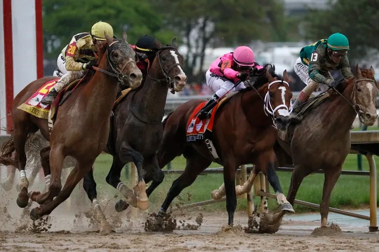 Flavien Prat on Country House, left, races against Luis Saez on Maximum Security, second from right, during the 145th running of the Kentucky Derby horse race at Churchill Downs Saturday, May 4, 2019, in Louisville, Ky. Maximum Security was disqualified and Country House won the race.