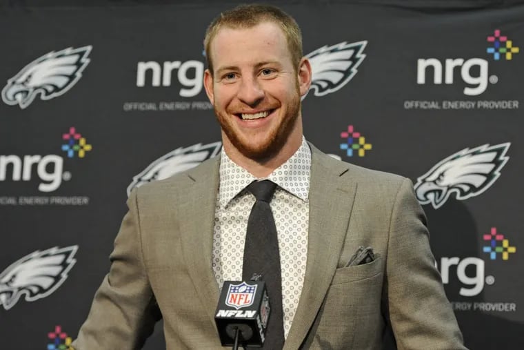 Philadelphia Eagles quarterback Carson Wentz speaks to the media after an NFL football game against the Carolina Panthers in Charlotte, N.C., Friday, Oct. 13, 2017. (AP Photo/Mike McCarn)
