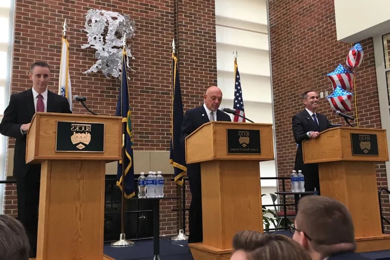 Republican Brian Fitzpatrick (left) and Democrat Steve Santarsiero (right) face off in a debate moderated by William Pezza at Bucks County Community College in Bristol earlier this month.