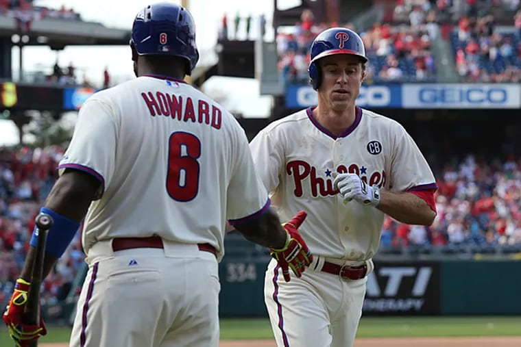Phillies first baseman Ryan Howard congratulates Chase Utley on his solo home run in the eighth inning against the Marlins on Sunday, April 13, 2014. (David Maialetti/Staff Photographer)