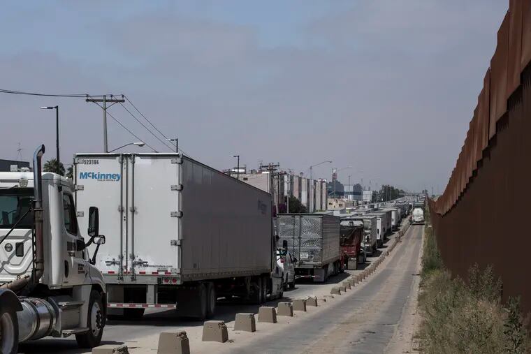 Trucks line up to cross into the United States at the border in Tijuana, Mexico, Friday, June 7, 2019. Companies have been rushing to ship as many goods as possible out of Mexico to get ahead of possible tariffs threatened by President Donald Trump, hurriedly sending cars, appliances and construction materials across the border to beat Monday’s deadline.