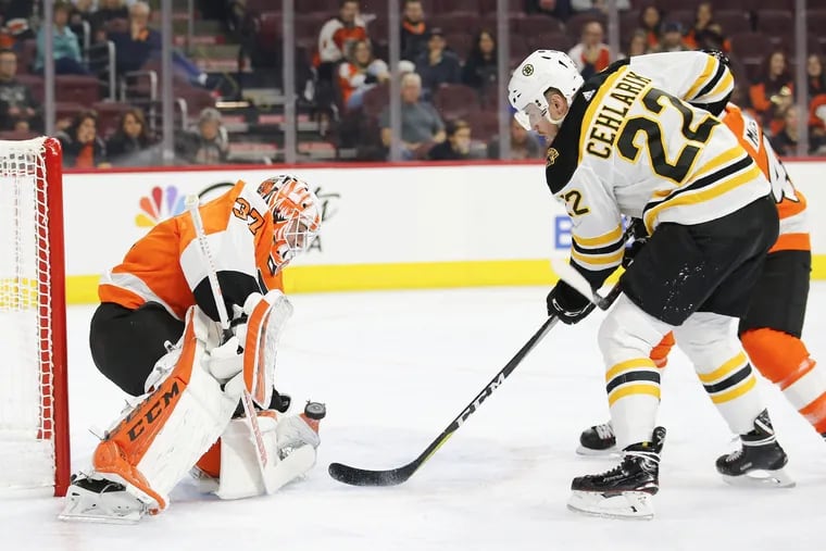 Boston's Peter Cehlarik scores past Flyers goaltender Brian Elliott during the first period.