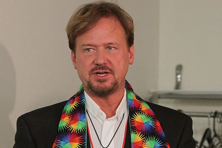 The Rev. Frank Schaefer, a United Methodist minister, was convicted in a church trial of breaking church law by officiating at his son's same-sex marriage in 2007. Here, Rev. Schaefer talks with the media shows after learning his faith a 30-day suspension. (Steven M. Falk / Staff Photographer)