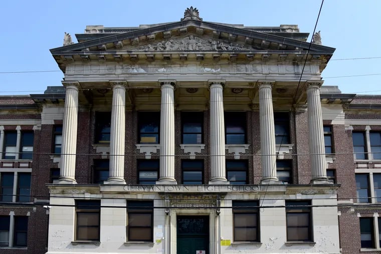 An entrance to Germantown High School, the sprawling building that has long been a fixture in the neighborhood. A development team headed by Jack Azran and Eli Alon is planning to redevelop the building, but residents want to ensure that they will benefit, too.