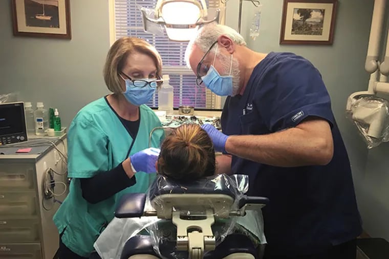 Dr. Joel Funari performs some 300 tooth extractions annually at his private practice in Devon, Pa.. He's part of a group of dentists reassessing opioid prescribing guidelines in Pennsylvania.