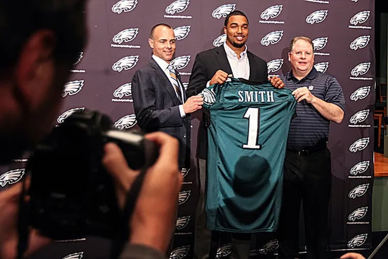 Eagles president Don Smolenski, 2014 first round pick Marcus Smith and head coach Chip Kelly. (Steven M. Falk/Staff Photographer)
