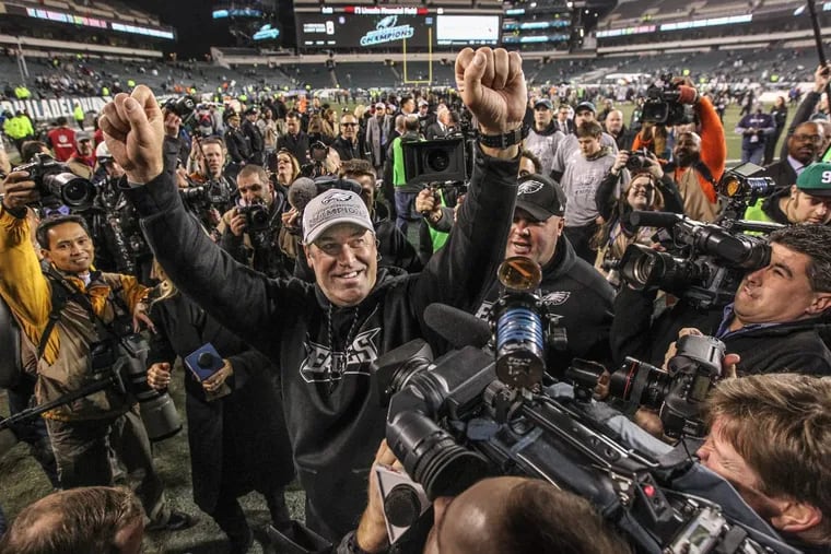 Cameras surround Eagles coach Doug Pederson after the NFC championship game win over Minnesota.