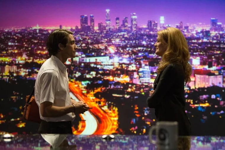 (Left to right) Jake Gyllenhaal as Lou Bloom and Rene Russo as Nina Romina in NIGHTCRAWLER, written and directed by Dan Gilroy, opening October 31, 2014.