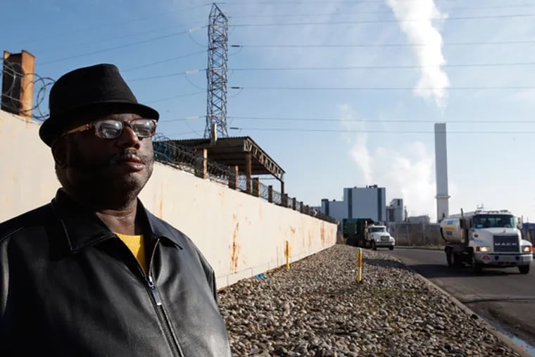 Horace Strand, pastor of Faith Temple Holy Church, stands outside the Covanta Energy trash to steam plant in Chester on Jan. 18, 2104. He is being awarded the Dr. Martin Luther King Drum Major Award. As chairman of the Chester Environmental Partnership, he has helped monitor environmental concerns in Chester. (MICHAEL S. WIRTZ/Staff Photographer)