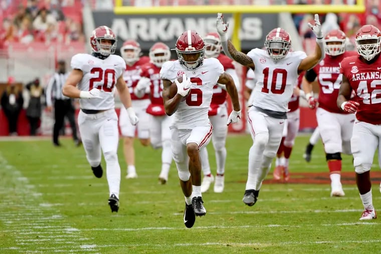 DeVonta Smith (6), outrunning Arkansas on a punt return in December, is expected to finally give the Eagles that much needed boost at wide receiver they've needed for years.