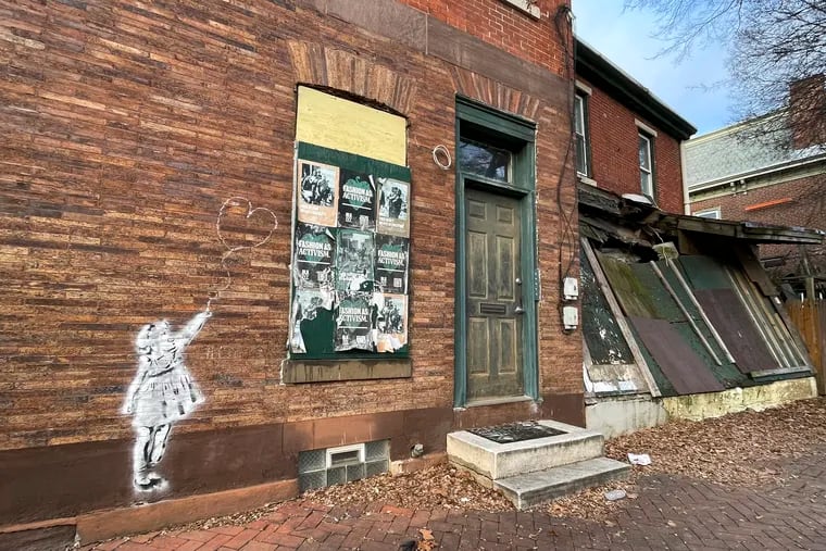 This abandoned building, at 201 N. 36th St., in the city's Powelton section has been listed for a tax sale. The owner owes more than $50,000 in property taxes. But the sheriff's office has not held such auctions in more than 2 1/2 years.