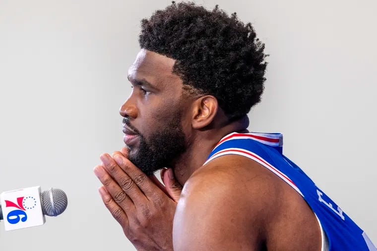 Sixers center, Joel Embiid takes a moment as he answers questions from reporters, during media day at the Seventy Sixers Practice Facility in Camden, N.J. Monday, September 27, 2021