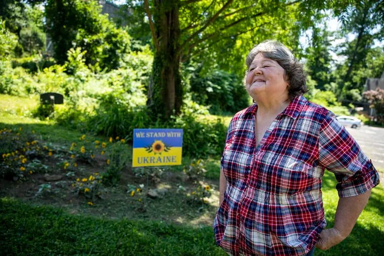 Janet Haas, member at The Unitarian Society of Germantown, talks about the creation and meaning of the sunflower garden, in Philadelphia, Pa., on June 4, 2022.