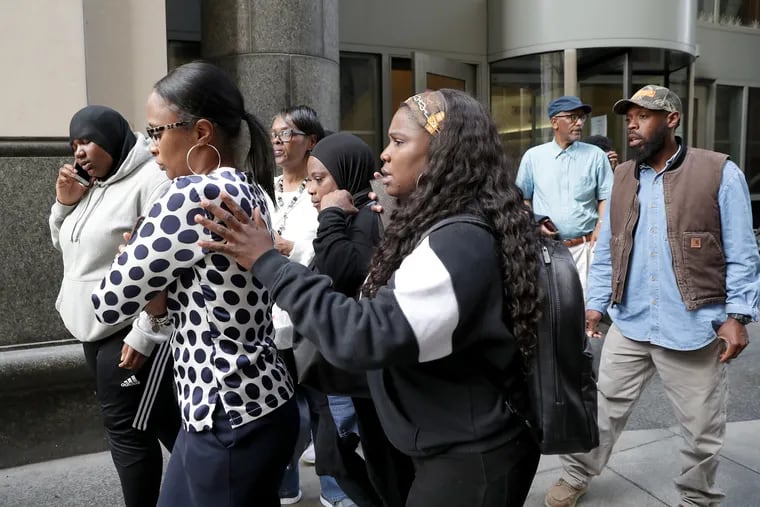 Williesha Robinson-Bethel, left (with ponytail), the mother of victim William Bethel IV, is comforted by supporters after the mixed verdicts by jurors on Thursday, April 18, 2019, following the trial against Zahmir White, the teen who fatally shot her 16-year-old son on Easter Sunday, April 1, 2018.