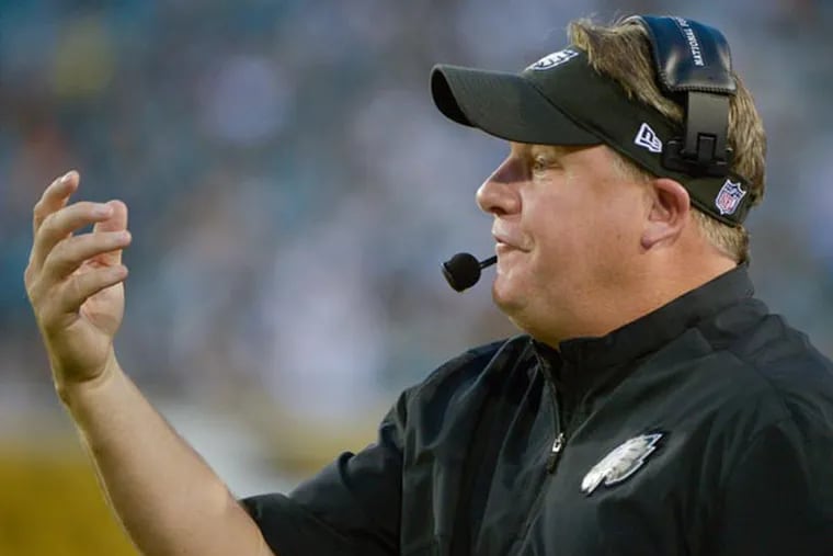 Chip Kelly directs his players against the Jacksonville Jaguars during the first half of an NFL preseason football game, Saturday, Aug. 24, 2013, in Jacksonville, Fla. (Phelan M. Ebenhack/AP)
