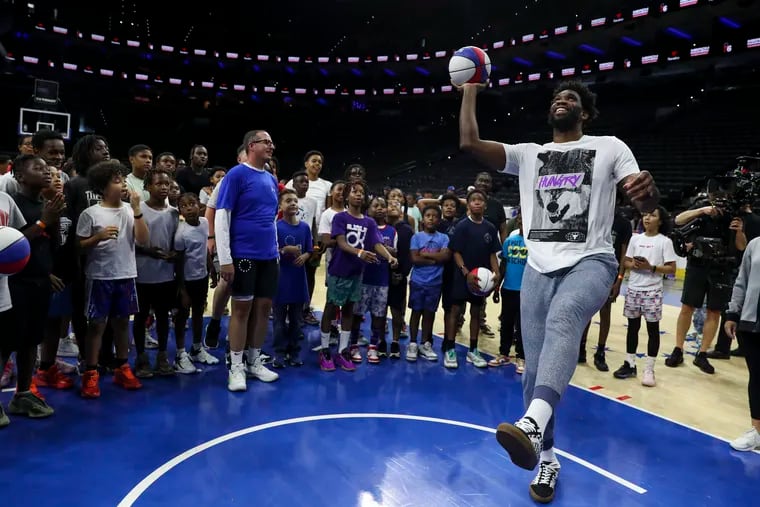 Joel Embiid plays games with kids during the "Merch Madness: Fan Gear Giveaway" hosted by Fanatics at the Wells Fargo Center in Philadelphia, Pa. on Tuesday, June 27, 2023. The youth attendees got to participate in basketball drills with Sixers players Joel Embiid and Tobias Harris, Eagles player Anthony Harris and rapper Lil Baby.