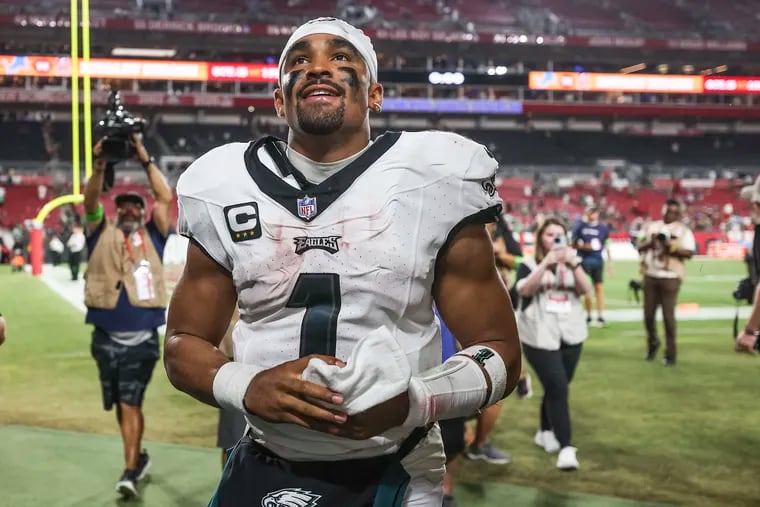 Philadelphia Eagles quarterback Jalen Hurts looks up at fans after a win against the Tampa Bay Buccaneers in Tampa, Fla., on Monday, Sept. 25, 2023.