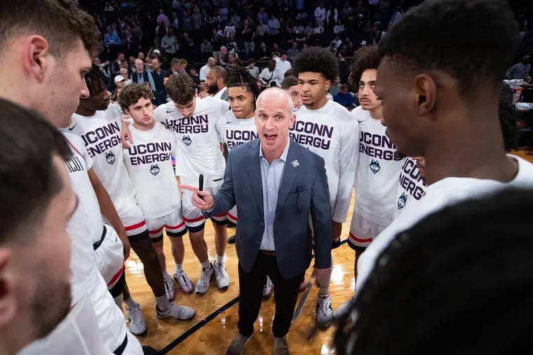 UConn coach Dan Hurley huddles his team before their semifinal game against St.John's in the Big East tournament on Friday.