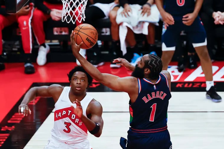 Sixers guard James Harden lays-up the basketball against Toronto Raptors forward OG Anunoby during game six of the first-round Eastern Conference playoffs on Thursday, April 28, 2022 in Toronto.