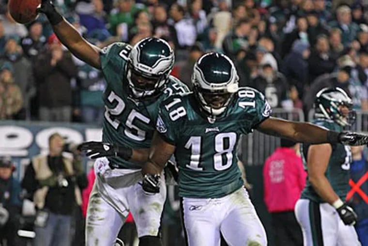 LeSean McCoy and Jeremy Maclin celebrate after McCoy's touchdown in the fourth quarter on Sunday. (Ron Cortes/Staff Photographer)