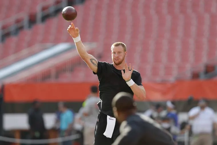 Eagles quarterback Carson Wentz throws the football to running back Darren Sproles before the Eagles played the Browns in a preseason.