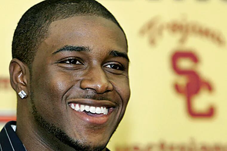 The NCAA issued bans for improper benefits given to former USC star Reggie Bush. (AP Photo/Reed Saxon, File)