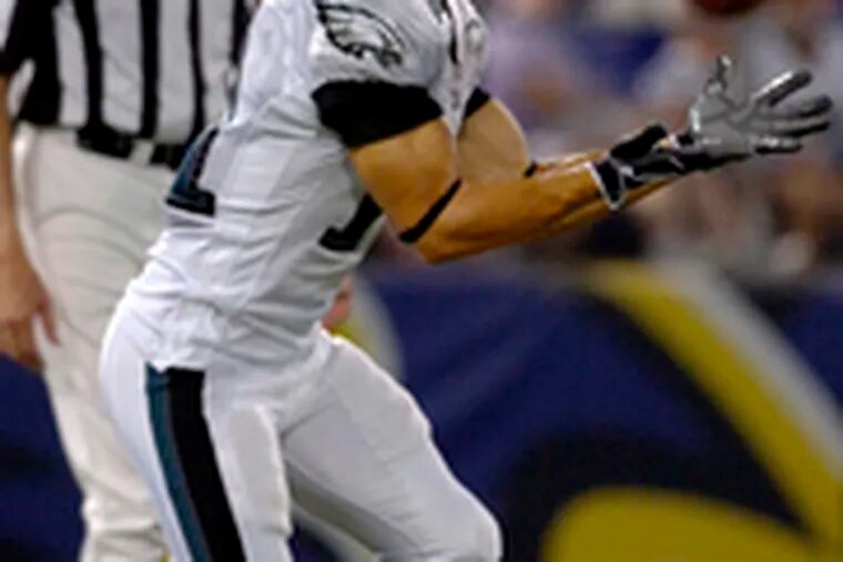 Eagles return man Jeremy Bloom catches a punt against Baltimore at M&T Bank Stadium.