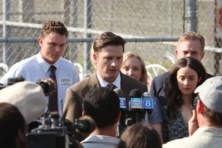 Newly released Death Row inmate Daniel Holden (Aden Young, center) addresses reporters in the Sundance Channel's new series "Rectify"