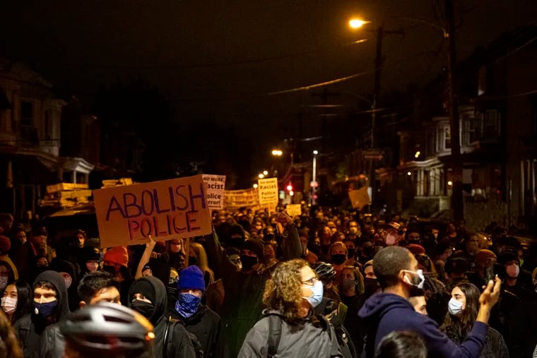 Protesters march along 51st Street on Oct. 27 after the death of Walter Wallace Jr. who was shot and killed by police officers the day before.