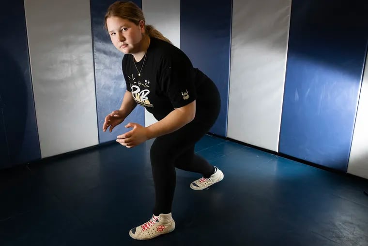 Souderton freshman girls' wrestler MacKenna Atkinson has battled a mysterious autoimmune condition for the last few years but has still excelled on the wrestling mat.  She is shown on April 3.