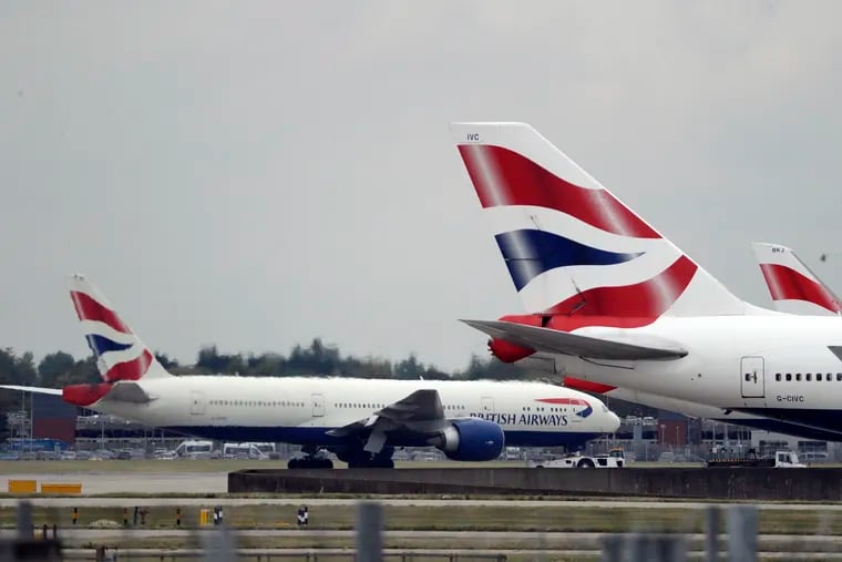 A British Airways plane, at left, is towed past other planes sitting parked at Heathrow Airport in London. British Airways and Asian budget carriers Lion Air and Seoul Air are suspending all flights to China as fears spread about the outbreak of a new virus that has killed more than 130 people. British Airways said Wednesday, Jan. 29, 2020, it is immediately suspending all flights to and from mainland China after the U.K. government warned against unnecessary travel to the country.