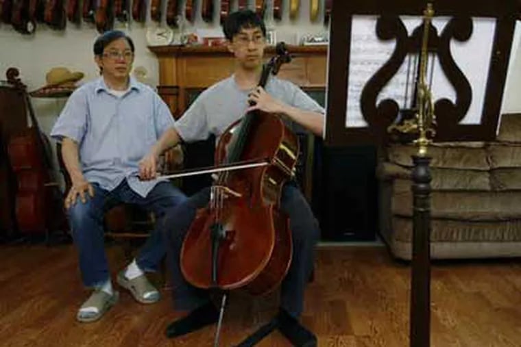 Above, Shu Sheng Kot listens to son Grant a student at the Juilliard School, play the cello that Kot made for him. Below, Kot planes a bow. It takes a week to make one, a month to make a violin. (Michael S. Wirtz / Staff Photographer)