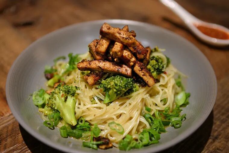 Singapore noodles with char siu tofu, broccoli, peanuts, and lime sambal. Global influences on V Street's concise, coherent vegan menu - just 13 savory items - include Hungarian, Peruvian, and Korean. (TOM GRALISH / Staff Photographer)