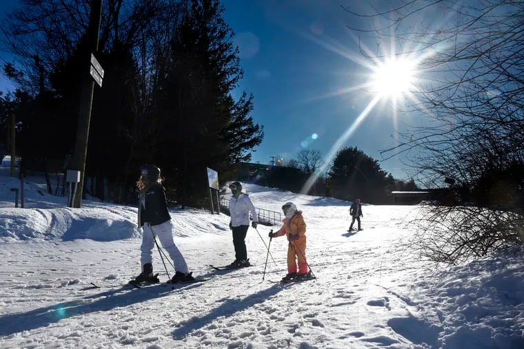 Skiers are on Blue Mountain in the Poconos on Wednesday, where after years of mild winters and lack of snow, ski resorts are experiencing a boom season with sell-out crowds driven to escape pandemic claustrophobia.
